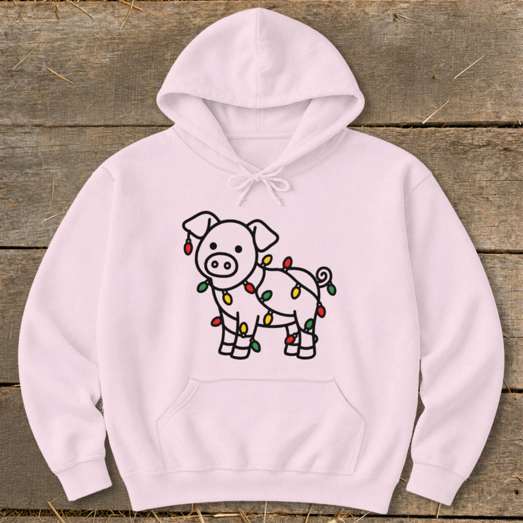 A light pink hooded sweatshirt with a cute pig graphic wrapped in Christmas lights.