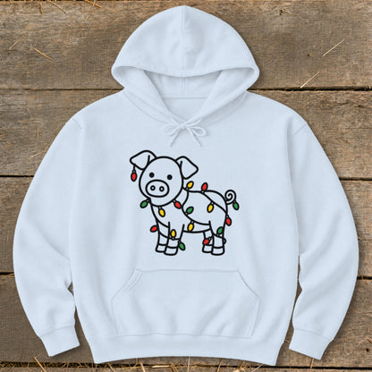 A white hooded sweatshirt featuring a line-art pig tangled in colorful Christmas lights.