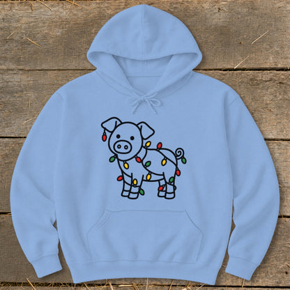 A light blue hooded sweatshirt features a black outline graphic of a pig wrapped in colorful Christmas lights.