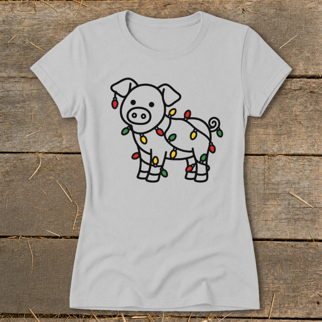 A light gray crewneck t-shirt featuring a line drawing of a pig wrapped in colorful Christmas lights.