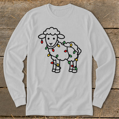 Light gray long-sleeve t-shirt featuring a cute illustrated sheep tangled in colorful Christmas lights.
