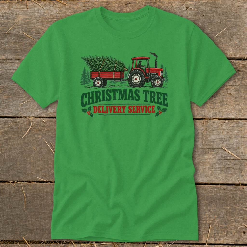 Green t-shirt with a red tractor towing a trailer with a Christmas tree.