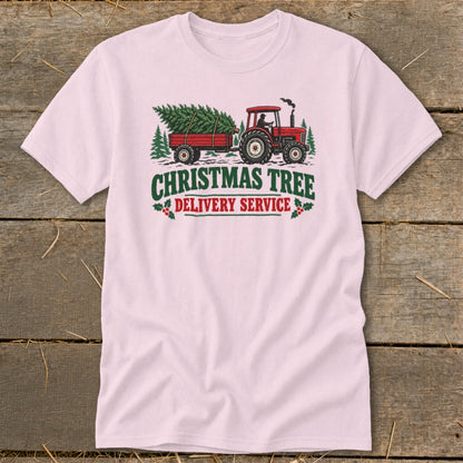 Red tractor hauling a Christmas tree on a trailer with "Christmas Tree Delivery Service" text.