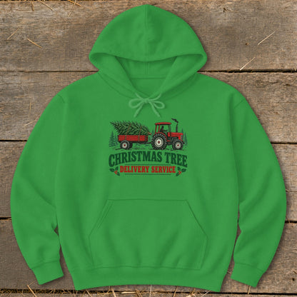 Green hoodie with "Christmas Tree Delivery Service" graphic of a tractor and trailer.