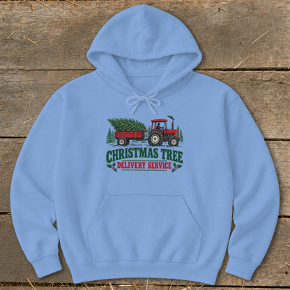 Light blue hoodie with Christmas Tree Delivery Service graphic of a tractor pulling a tree.
