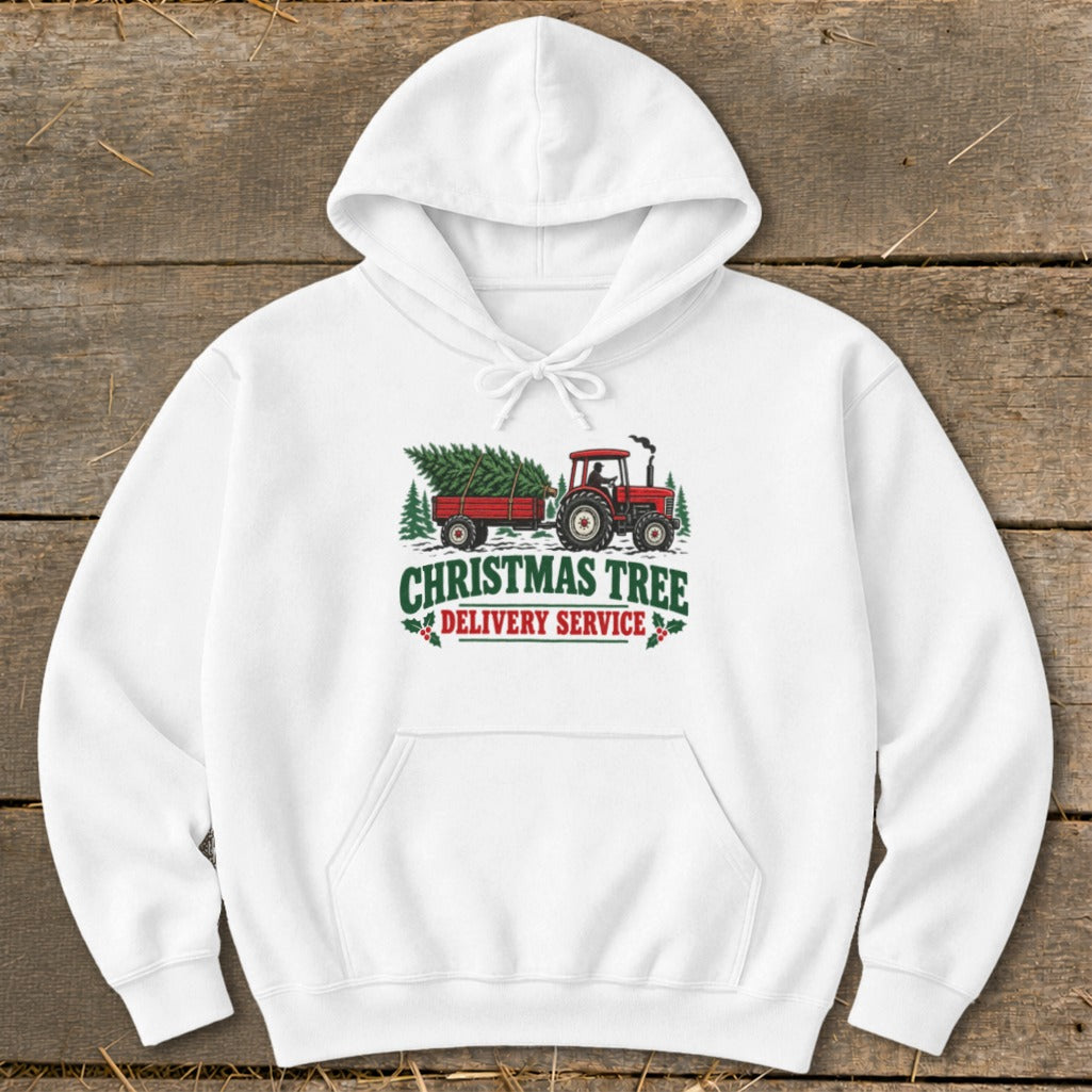 White hoodie with "Christmas Tree Delivery Service" graphic of a tractor and trailer.