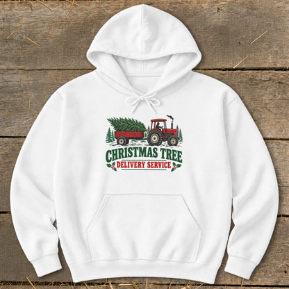 White hoodie with "Christmas Tree Delivery Service" graphic of a tractor and trailer.