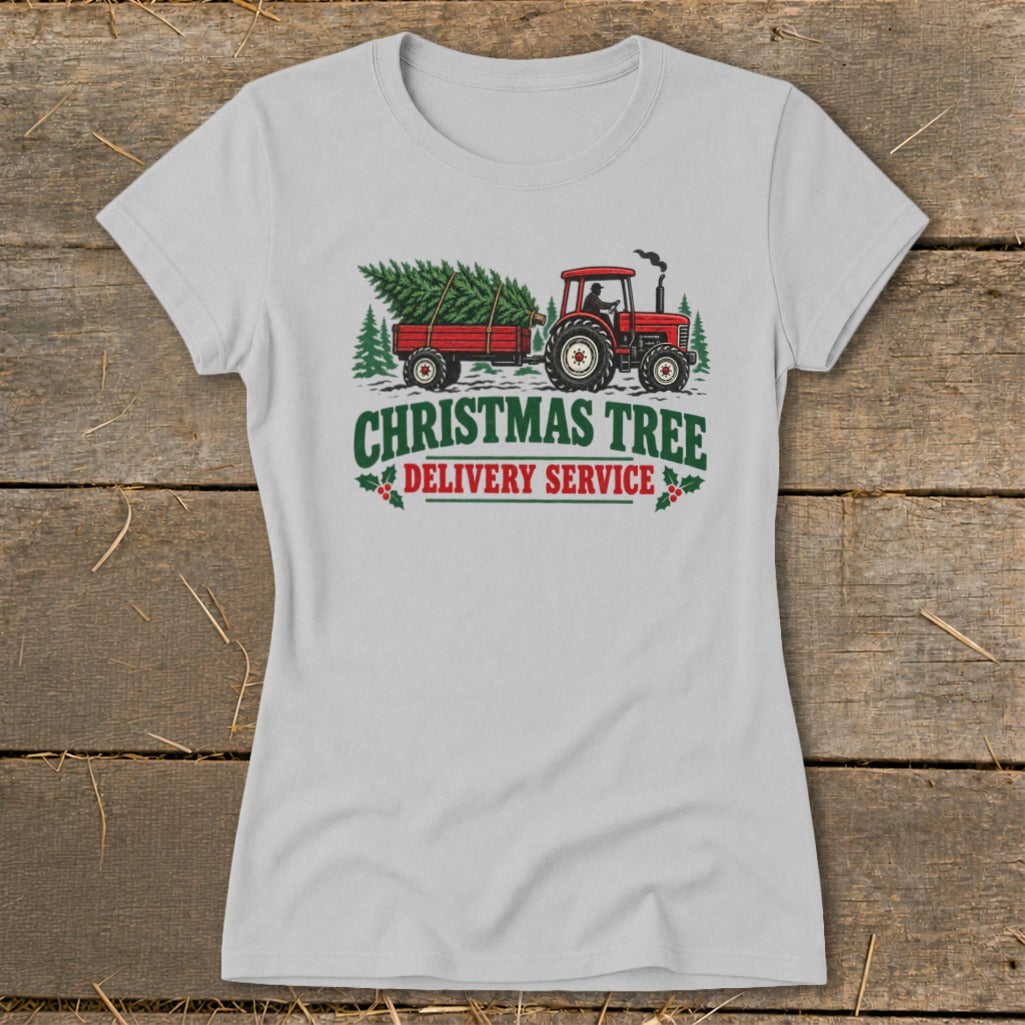 Tractor pulling a Christmas tree trailer with text "Christmas Tree Delivery Service".