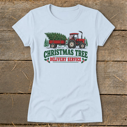 Red tractor pulling a trailer with Christmas trees, text reads "Christmas Tree Delivery Service."