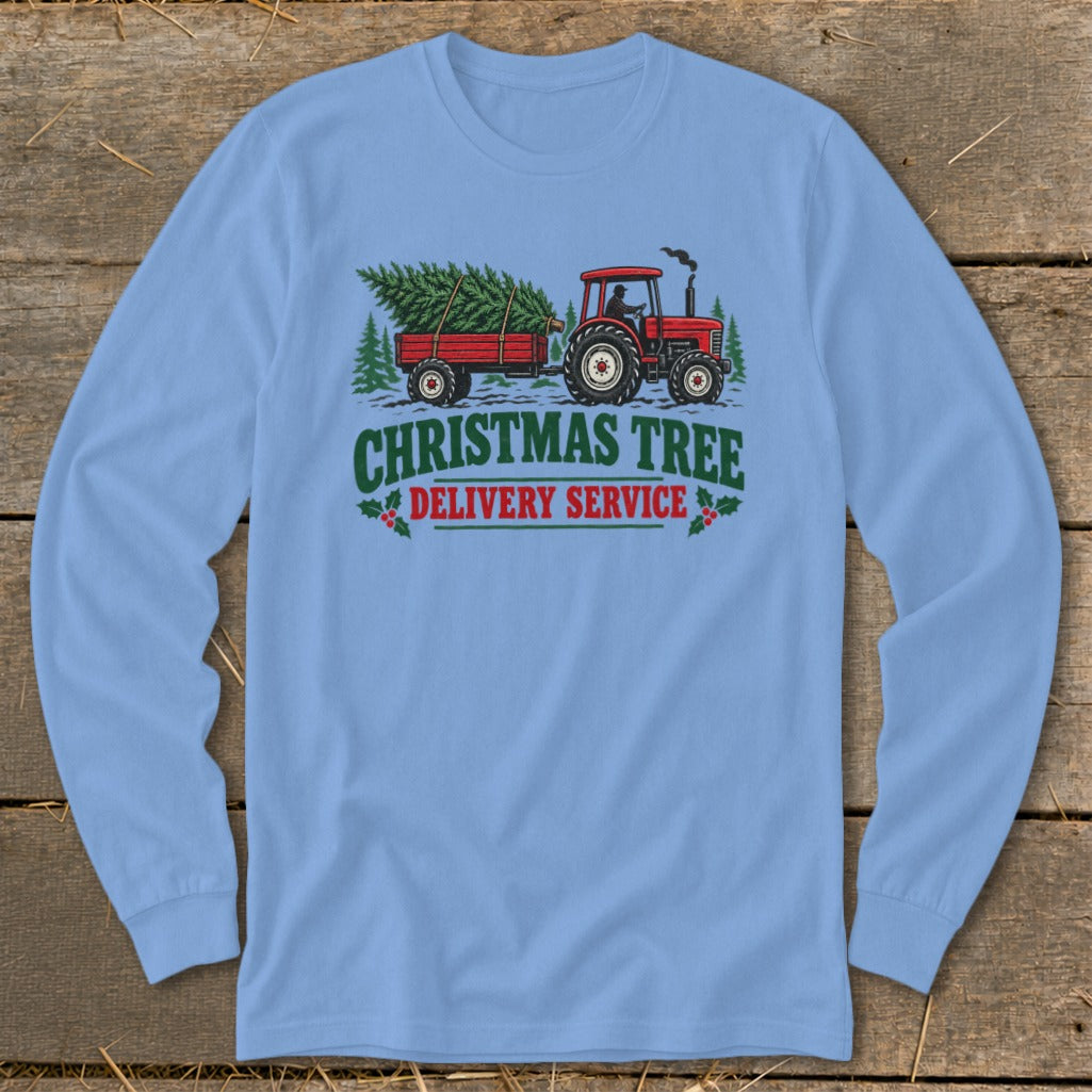 Red tractor pulling Christmas tree on trailer with text "Christmas Tree Delivery Service."