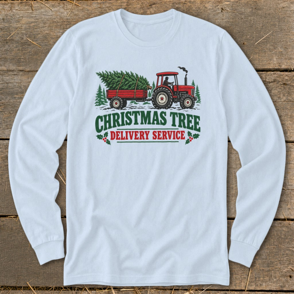 Red tractor pulling a Christmas tree in a wagon with "Christmas Tree Delivery Service" text.