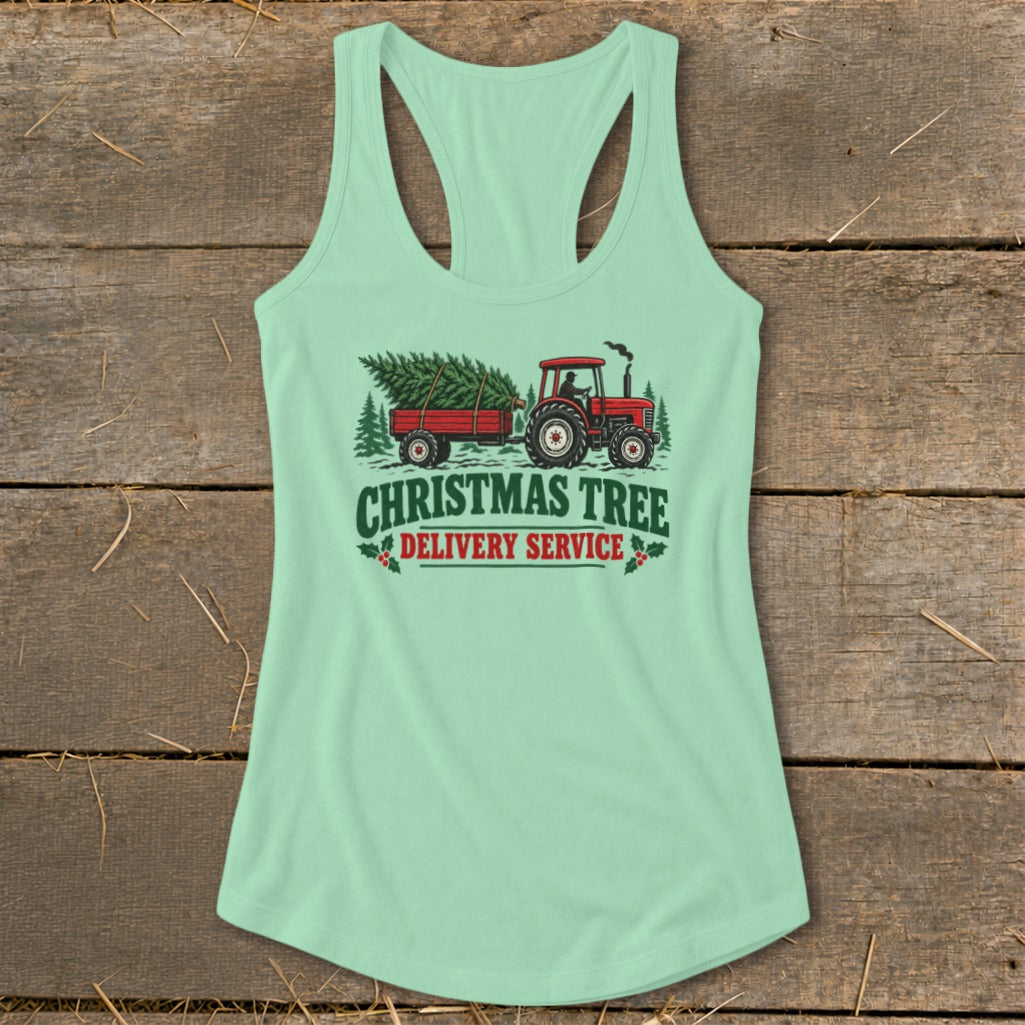 Graphic of red tractor pulling trailer with Christmas tree, text "CHRISTMAS TREE DELIVERY SERVICE".