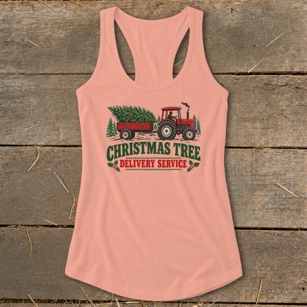 Peach tank top with Christmas Tree Delivery Service graphic featuring a red tractor and trailer.