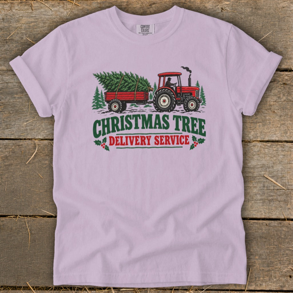 Red tractor pulling a Christmas tree on a trailer with text.