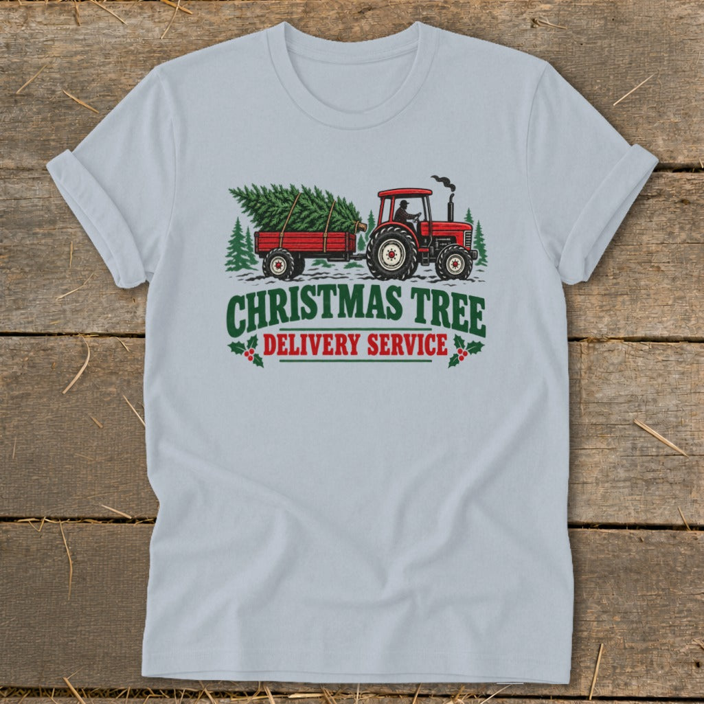 Tractor pulling a Christmas tree on a trailer with text "Christmas Tree Delivery Service".