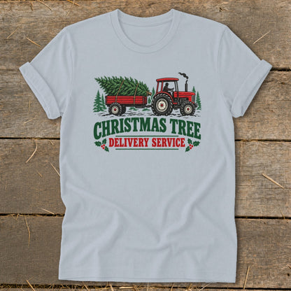 Tractor pulling a Christmas tree on a trailer with text "Christmas Tree Delivery Service".