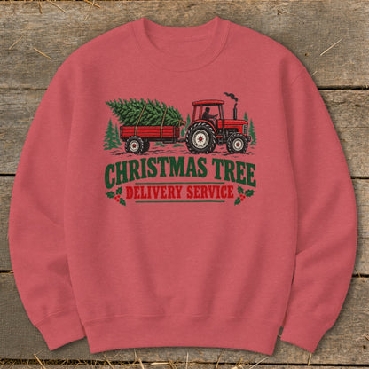 Red tractor pulling a trailer with a Christmas tree, text reads "Christmas Tree Delivery Service."