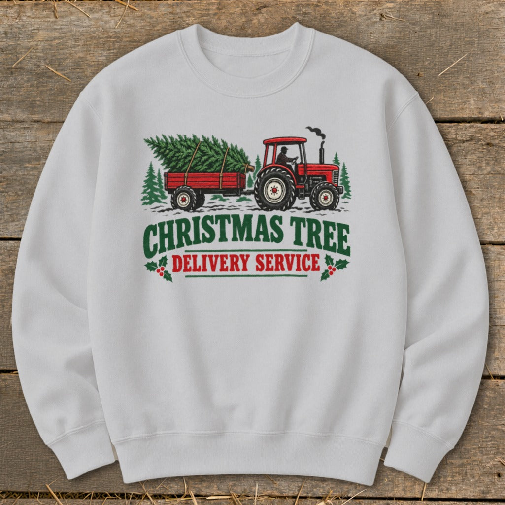 White sweatshirt with red tractor towing Christmas tree and text "CHRISTMAS TREE DELIVERY SERVICE".