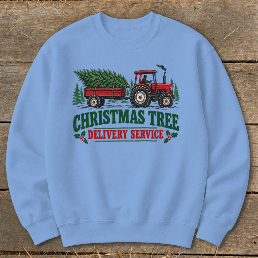 Red tractor pulling a trailer with a Christmas tree, with text "Christmas Tree Delivery Service".