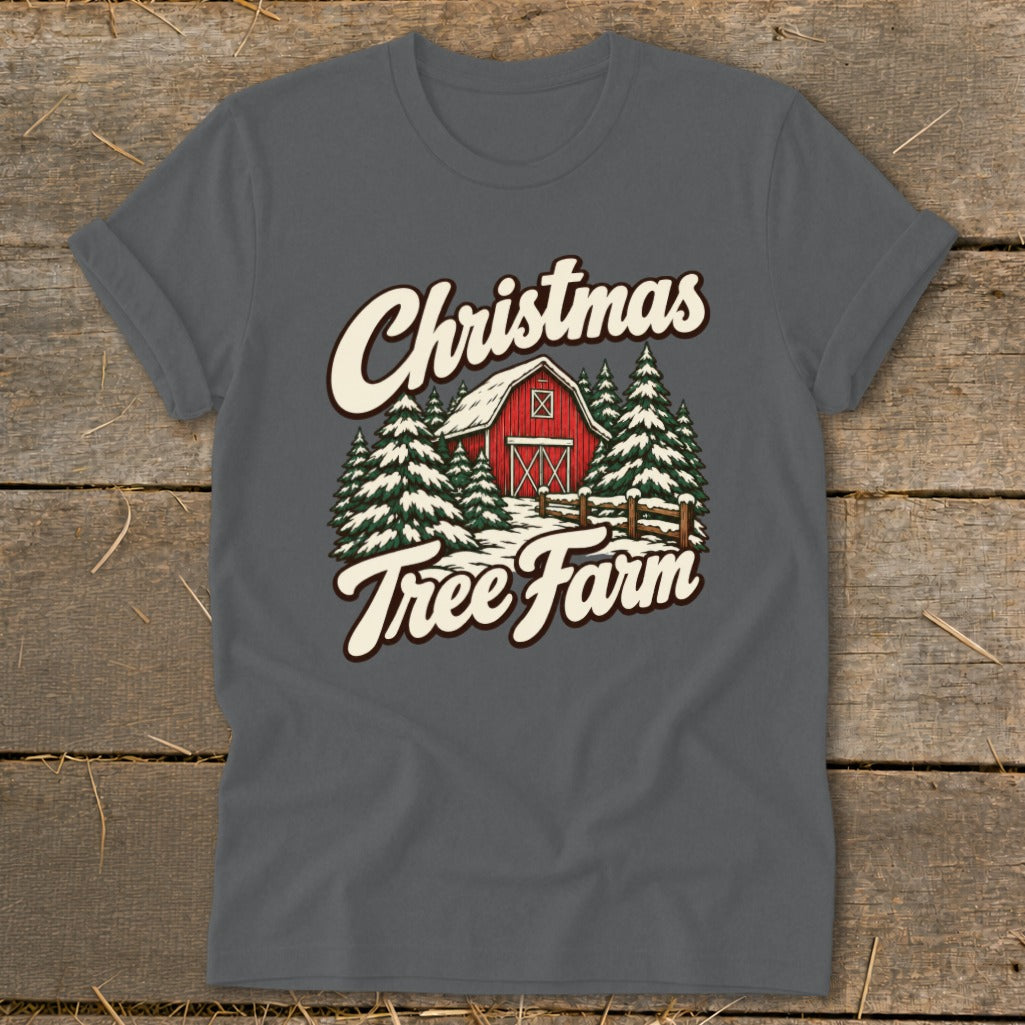 Christmas Tree Farm graphic on a grey t-shirt with a red barn and snow-covered trees.