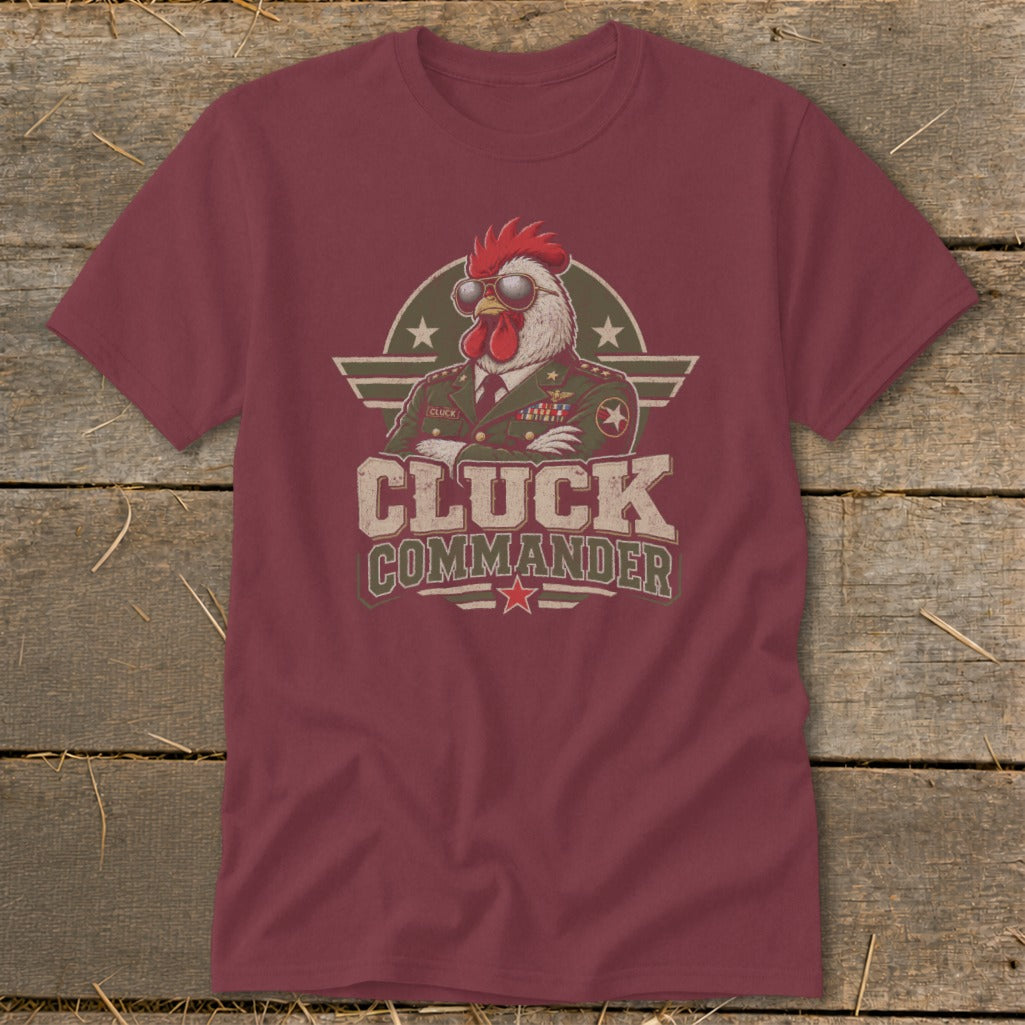 Maroon t-shirt featuring a graphic of a rooster in a military uniform wearing sunglasses, with the text Cluck Commander.