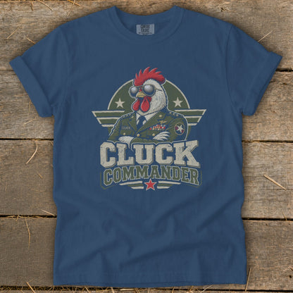Blue t-shirt featuring a graphic of a rooster wearing sunglasses and a military uniform with the text Cluck Commander.