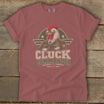 Muted red t-shirt featuring a graphic of a rooster in a military uniform with the text Cluck Commander.