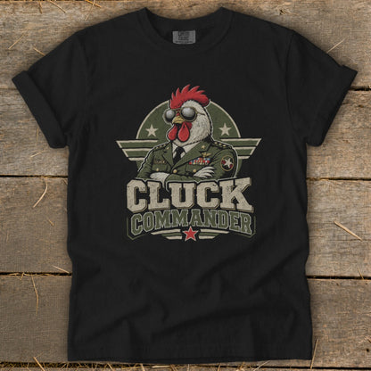 A black t-shirt features a graphic of a rooster in a military uniform wearing sunglasses, with the text Cluck Commander.