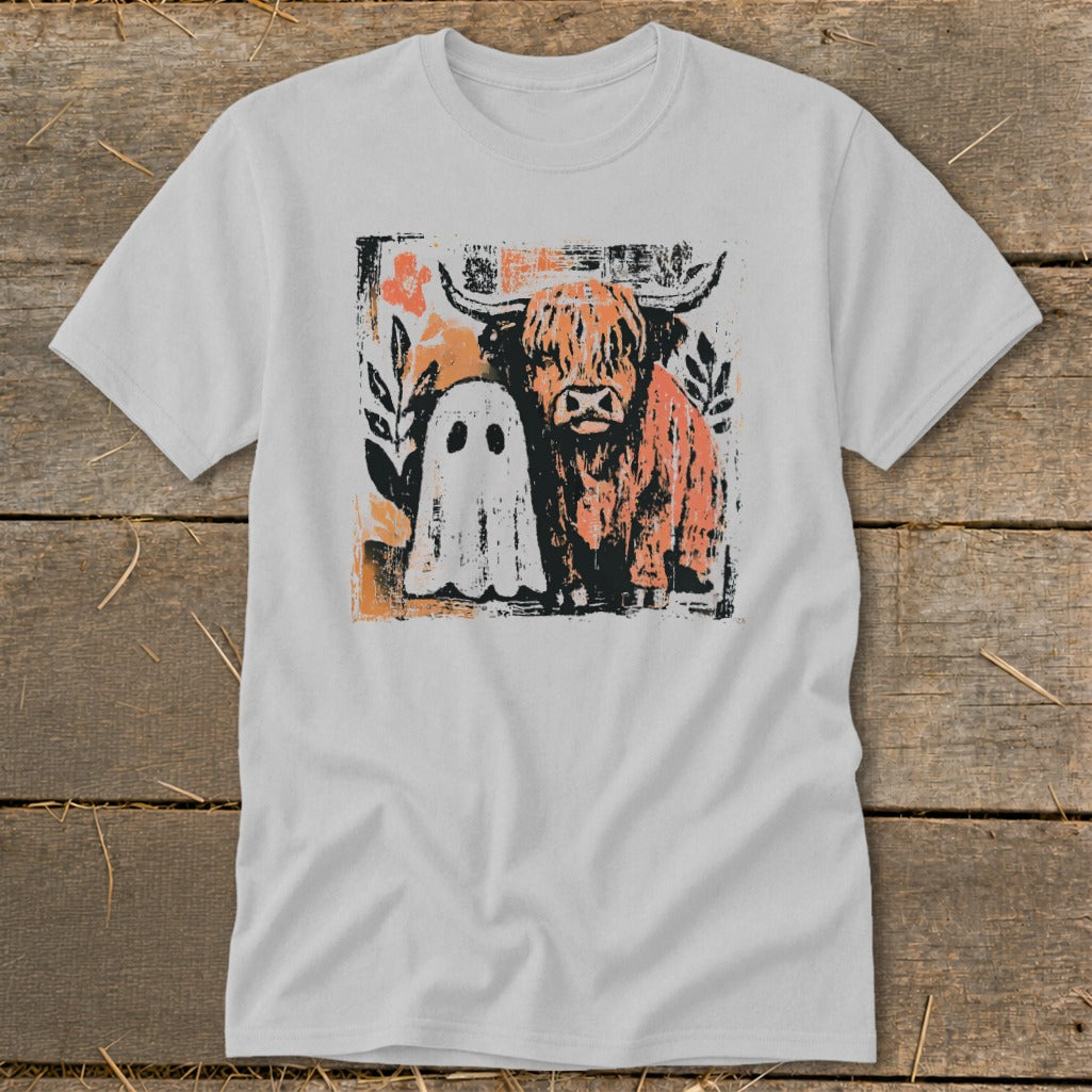 Highland cow and friendly ghost graphic on a light gray t-shirt.