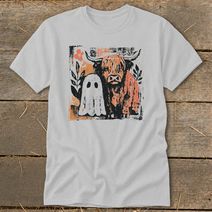 Highland cow and friendly ghost graphic on a light gray t-shirt.