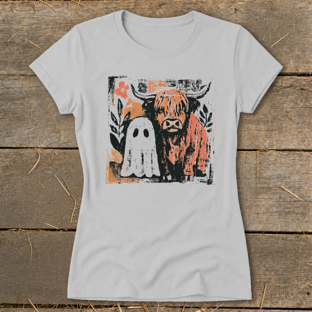 Highland cow and ghost graphic with floral accents on a light grey t-shirt.