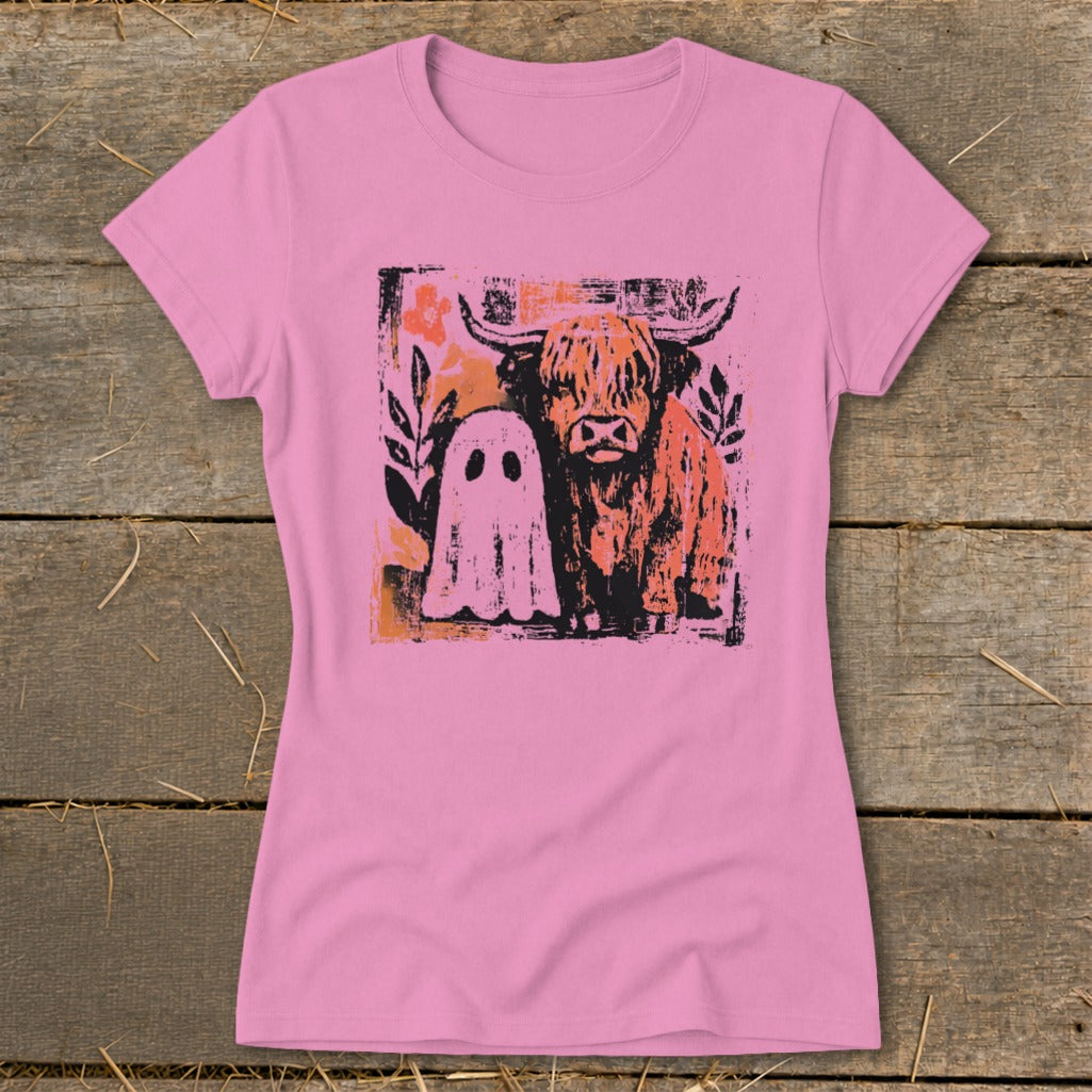 Pink t-shirt with graphic of a highland cow and a ghost.