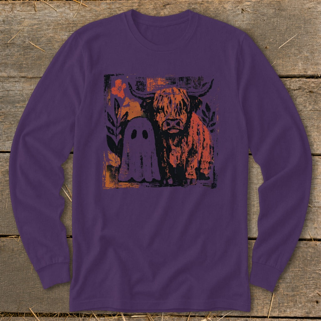 Highland cow and ghost graphic on purple long-sleeve shirt.
