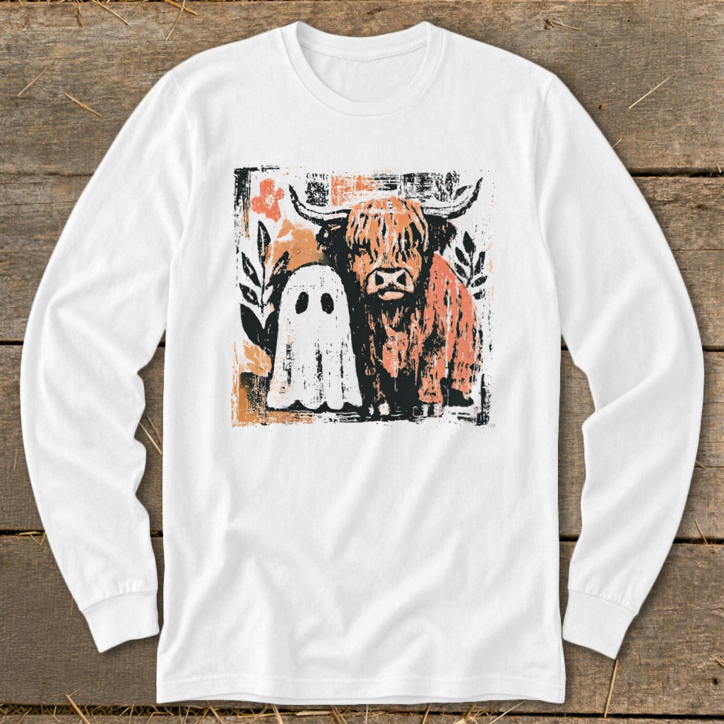 White long-sleeve shirt with Highland cow and ghost graphic.
