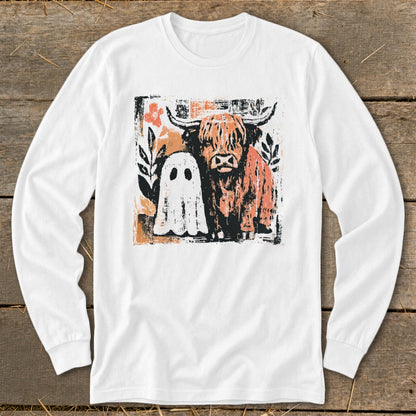 White long-sleeve shirt with Highland cow and ghost graphic.