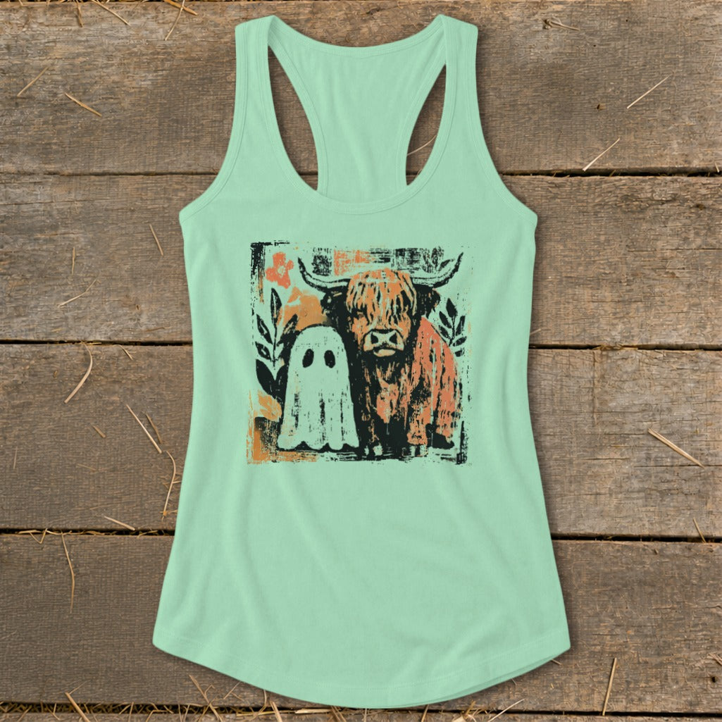 Highland cow and ghost graphic on a mint green tank top.