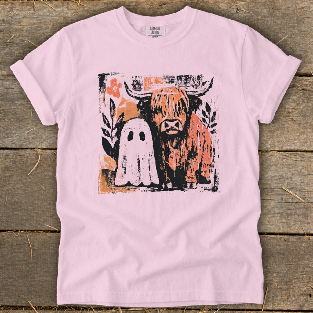 Pink t-shirt with a distressed graphic of a highland cow and a ghost.