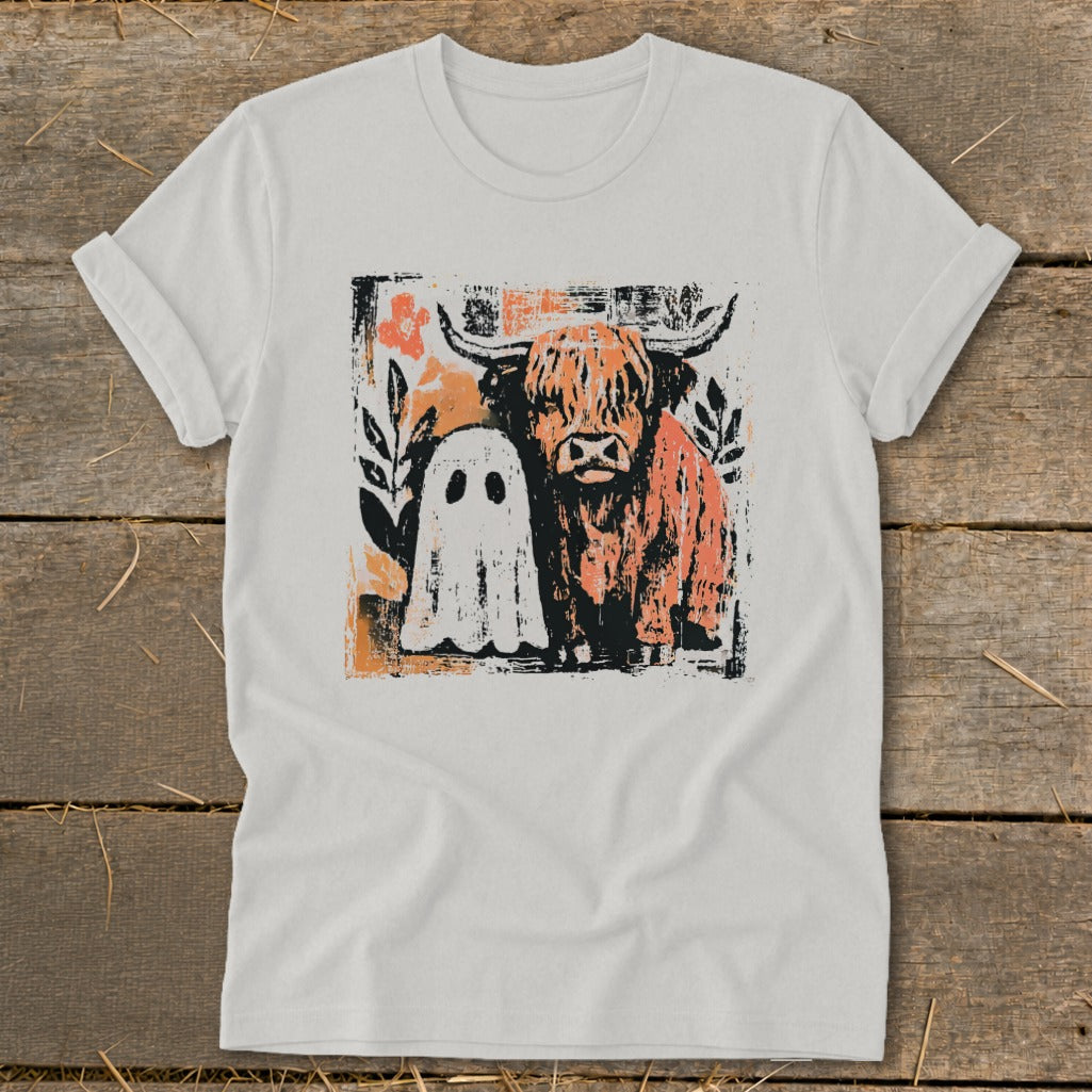 White t-shirt with distressed graphic of a Highland cow and a ghost.