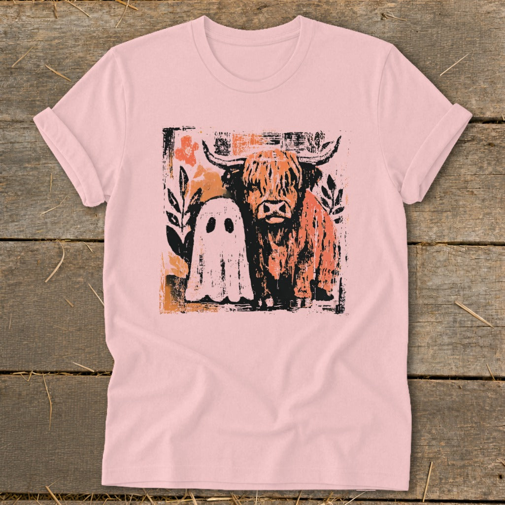 Pink t-shirt with a grunge graphic of a Highland cow and a ghost.