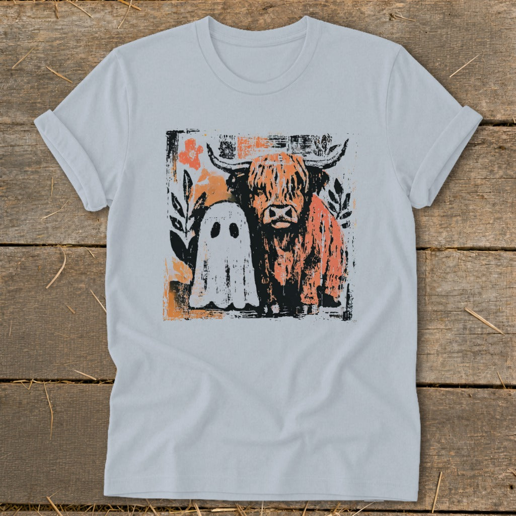 Highland cow and ghost graphic on a light grey t-shirt.