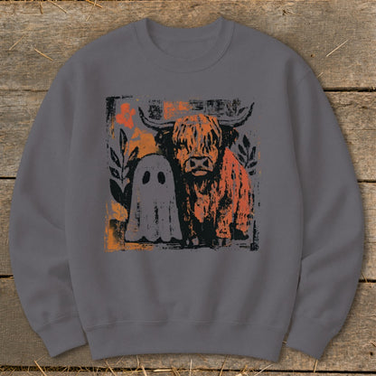Highland cow and ghost graphic on a gray sweatshirt.