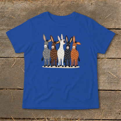 A royal blue t-shirt printed with five illustrated donkeys standing in a row on a wooden background.