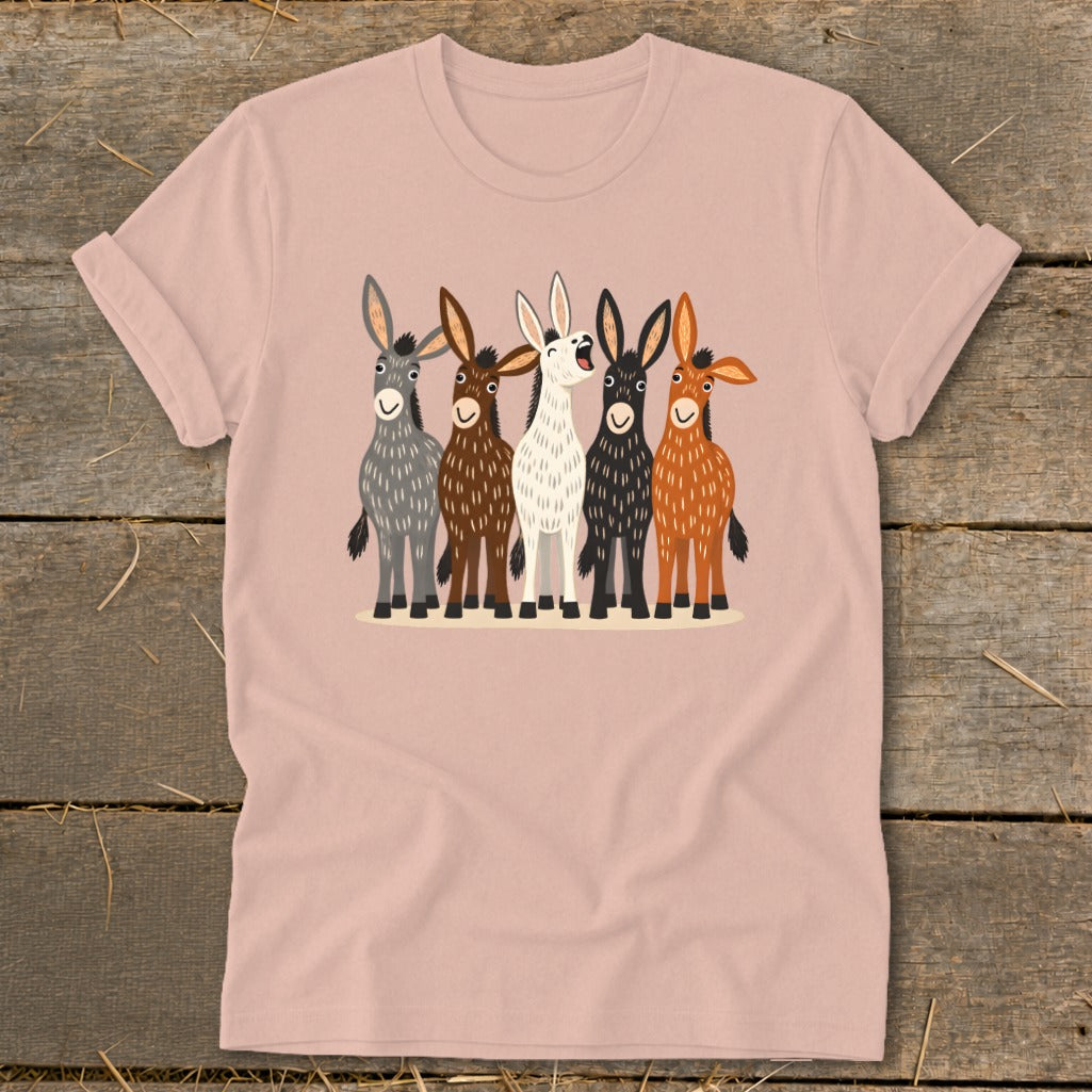 A dusty pink t-shirt featuring a front graphic of five cartoon donkeys in various colors.