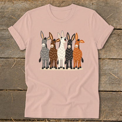 A dusty pink t-shirt featuring a front graphic of five cartoon donkeys in various colors.