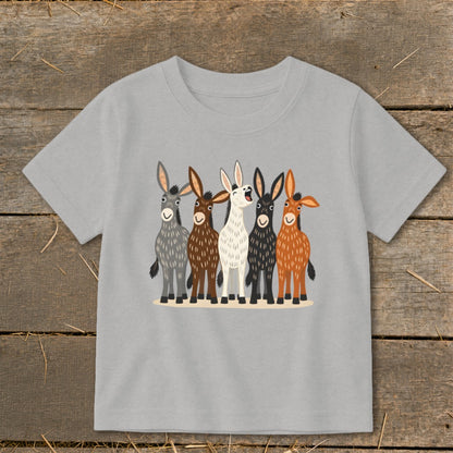 Light gray short-sleeve children's t-shirt printed with five illustrated cartoon donkeys in various colors.
