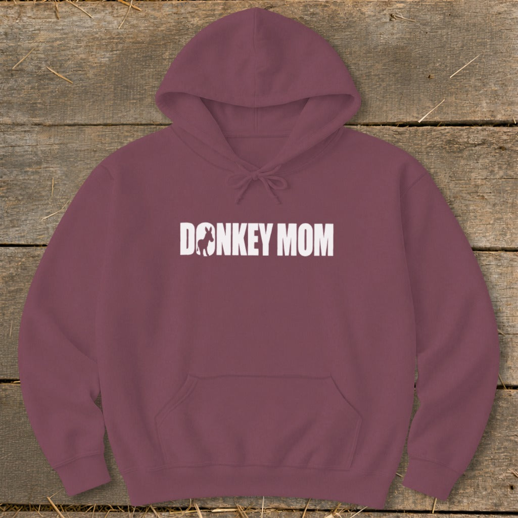 Maroon hoodie featuring the white text DONKEY MOM, with a donkey silhouette replacing the letter O.