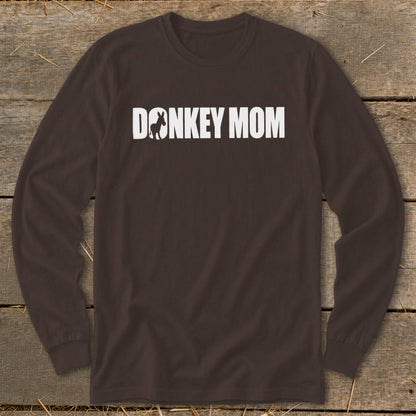 A dark brown long-sleeve t-shirt with white text that reads DONKEY MOM, featuring a donkey silhouette inside the letter O.
