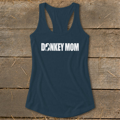 Dark blue racerback tank top with white Donkey Mom text centered on a wooden background.