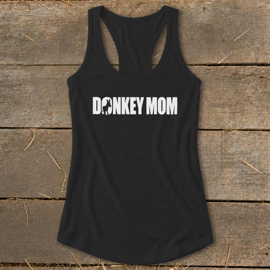 A black racerback tank top featuring the white text DONKEY MOM with a donkey silhouette replacing the letter O.