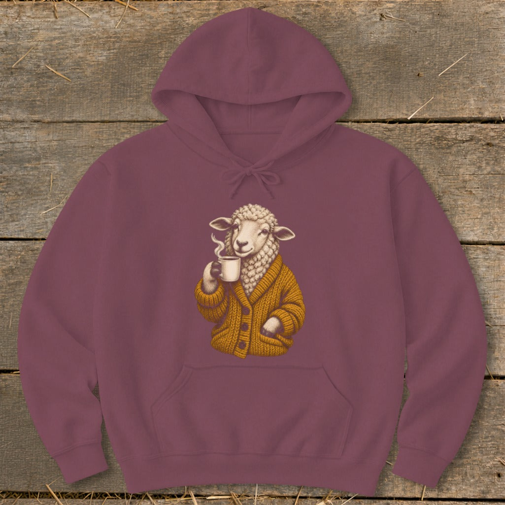 Maroon hoodie featuring a graphic of a sheep wearing a yellow cardigan and drinking coffee.